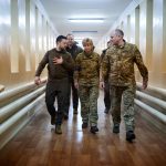 FILE PHOTO: Ukraine's President Volodymyr Zelenskiy visits an injured servicemen in Kyiv