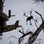 Ukrainian serviceman launches a kamikaze FPV drone at a front line near the city of Bakhmut